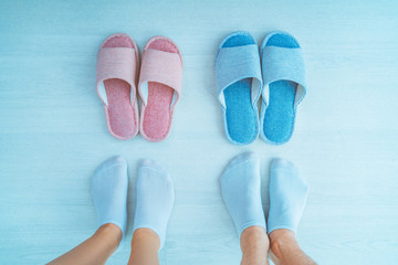 Loving family couple in home cozy soft comfortable slippers. Family concept, top view