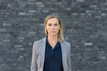 Portrait of determined middle-aged business woman