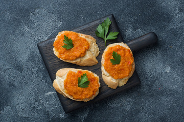 Sandwiches with bread zucchini caviar tomatoes onions. Homemade vegetarian food. Copy space.