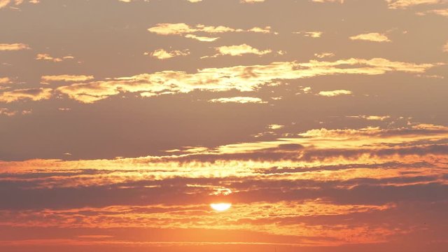 Beautiful sunset in evening time, 4K Time lapse, beautiful sky with clouds background. Sunset sky clouds, zoom in footage.