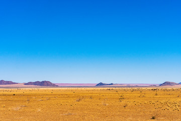 Beautiful view of desert with clear blue sky from road trip in NAMIBIA