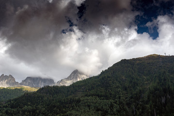 Obraz na płótnie Canvas Summits of Alps in clouds, Chamonix, France.