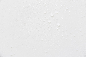 Raindrops on a grayish white background. Rainy season concept.