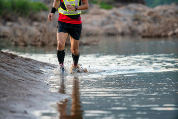 Trail running  moving on the water lakeside freedom