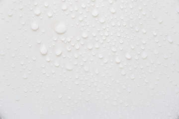 Raindrops on a grayish white background. Rainy season concept.