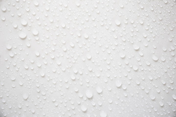 Fototapeta na wymiar Raindrops on a grayish white background. Rainy season concept.