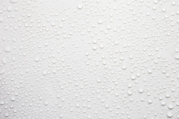Raindrops on a grayish white background. Rainy season concept.