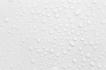 Raindrops on a grayish white background. Rainy season concept.
