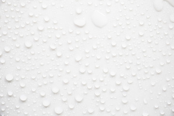 Raindrops on a grayish white background. Rainy season concept.