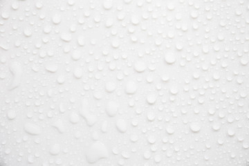 Raindrops on a grayish white background. Rainy season concept.