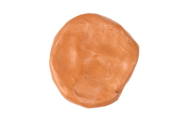Brown plasticine isolated on white background.
