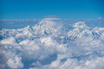 Fototapeta na wymiar Above the clouds in Himalayas mountain range, Nepal