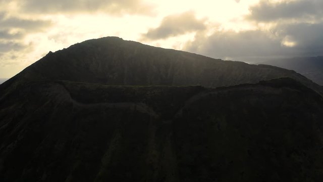 4K footage of a gaint ancient volcano crater at sunset.