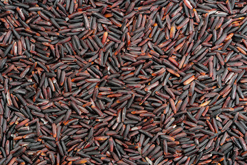.organic black jasmine rice background , black rice berry