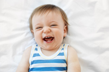 Portrait of laughing baby boy with open mouth