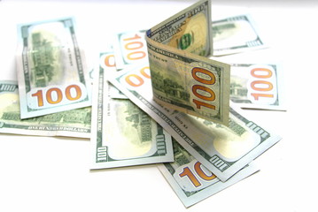 One hundred dollars. Money. Paper bills in denominations of one hundred dollars. Business and Finance.