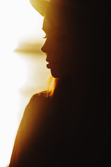 Close up portrait of beautiful young woman on the beach. Young caucasian female model on the sea shore.