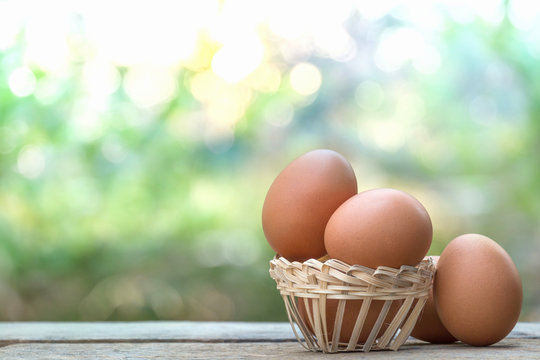 brown eggs in basket on bokeh background