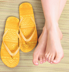 Closeup photo of a beautiful female feet with pedicure