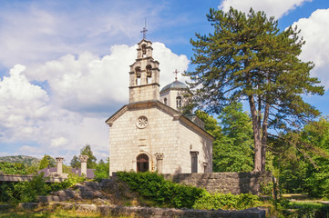 Fototapeta na wymiar Church of Birth of Our Lady ( Court Church on Cipur ) in Cetinje town on sunny summer day, Montenegro