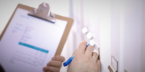 File folders, standing on shelves in the background