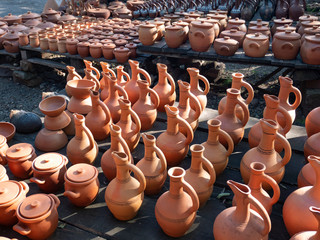 Fototapeta na wymiar Many earthenware jugs for wine and food. Georgia