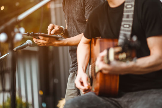 Close-up Of Musicians, Guitarists Playing Blues. Singers Are Checking Their Voices To Prepare For Outdoor Concerts. Music Concepts.