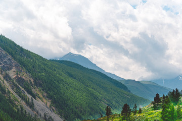 Mountain range under clouds. Rocks for Hiking and tourism