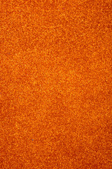 Orange glitter background, selective focus
