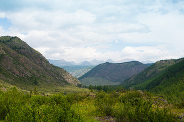 Mountain range under clouds. Rocks for Hiking and tourism