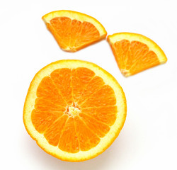 Sliced ​​Orange. Different shaped pieces of fruit.