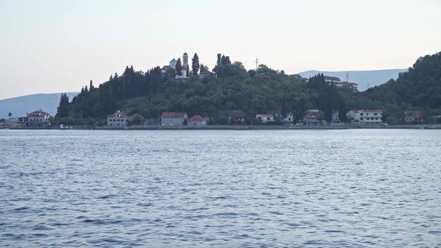 Kamenari, Montenegro. The Church on the hill at the entrance to Boka Bay