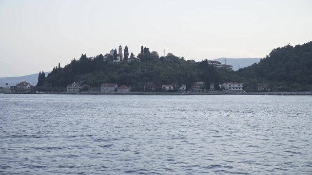 Kamenari, Montenegro. The Church on the hill at the entrance to Boka Bay