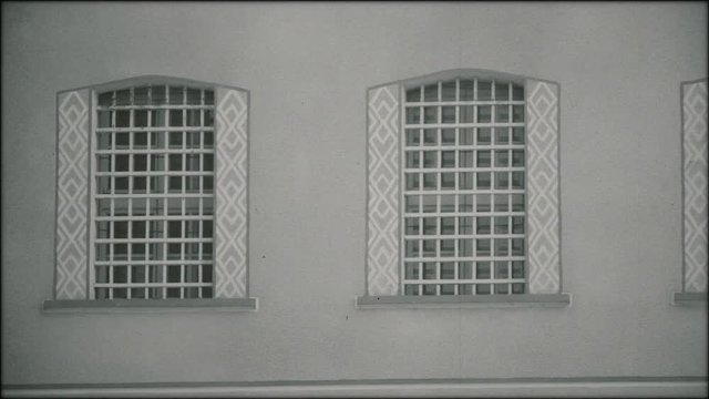 Prison building from Eastern Bloc during communist era (1940s, 1950s).
Archive, black and white footage.