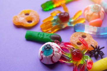 halloween candies seen close up on purple background