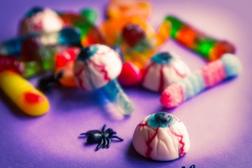 halloween candies seen close up on purple background