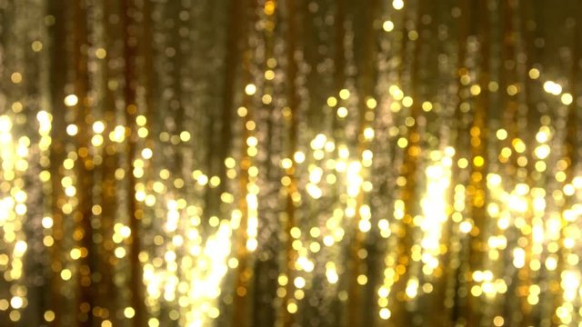 Glowing golden sequin background. Shimmering luxury carnival for ladies.