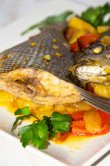 stewed fish dish with potatoes and peppers