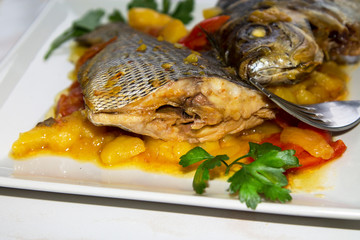 stewed fish dish with potatoes and peppers