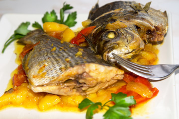 stewed fish dish with potatoes and peppers