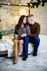 Obraz premium boy and girl in christmas decorations