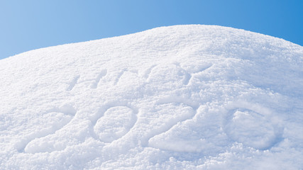 Fototapeta na wymiar 2020 happy new year on white winter snow texture background for Christmas seasonal greeting on ice frost 