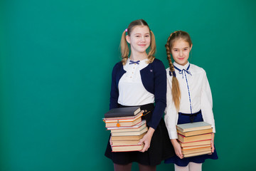 two girls keep a lot of books at school