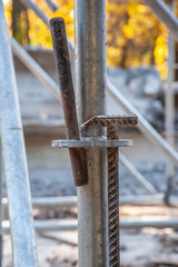 Reinforcing hammer in scaffolding close-up