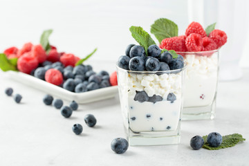 Cottage cheese with cream, raspberry and blueberry.