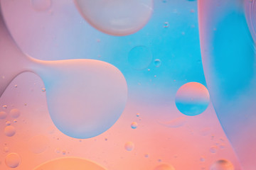 Defocused pastel colored abstract background picture made with oil, water and soap