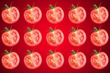 Vegetable pattern of red tomatoes sliced ​​on red background.