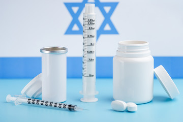 Coins stacked on each other in different positions on colored background. Pharmaceutical industry in Israeli.