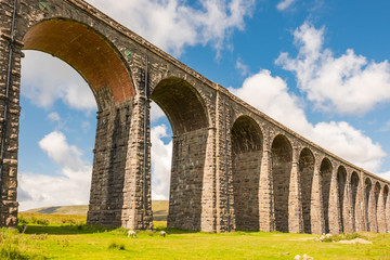 Fototapeta premium Famous Ribble Valley viaduct railway crossing showing detail of the stonework under-structure. Guttering and tile-work can be seen also