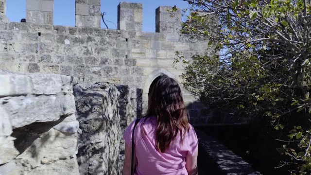 Girl walking in the Lisbon Castle - The Castelo de Sao Jorge